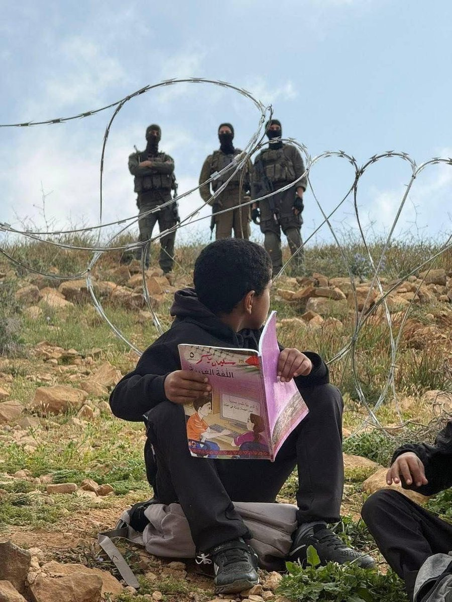 Israeli occupation forces block students of Umm al-Khair School from reaching their school.