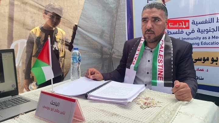 Al-Azhar University student defends his thesis in a tent.